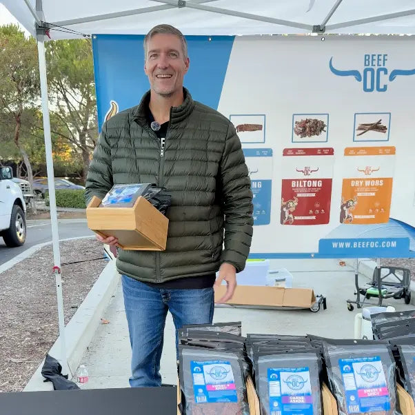 Jeff Wain holding Beef OC biltong products